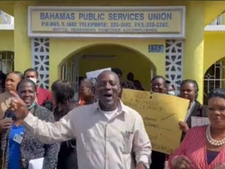 Public servants protest outside the Ministry of Social Services